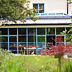 Glass fronted modern house extension with glazed roof